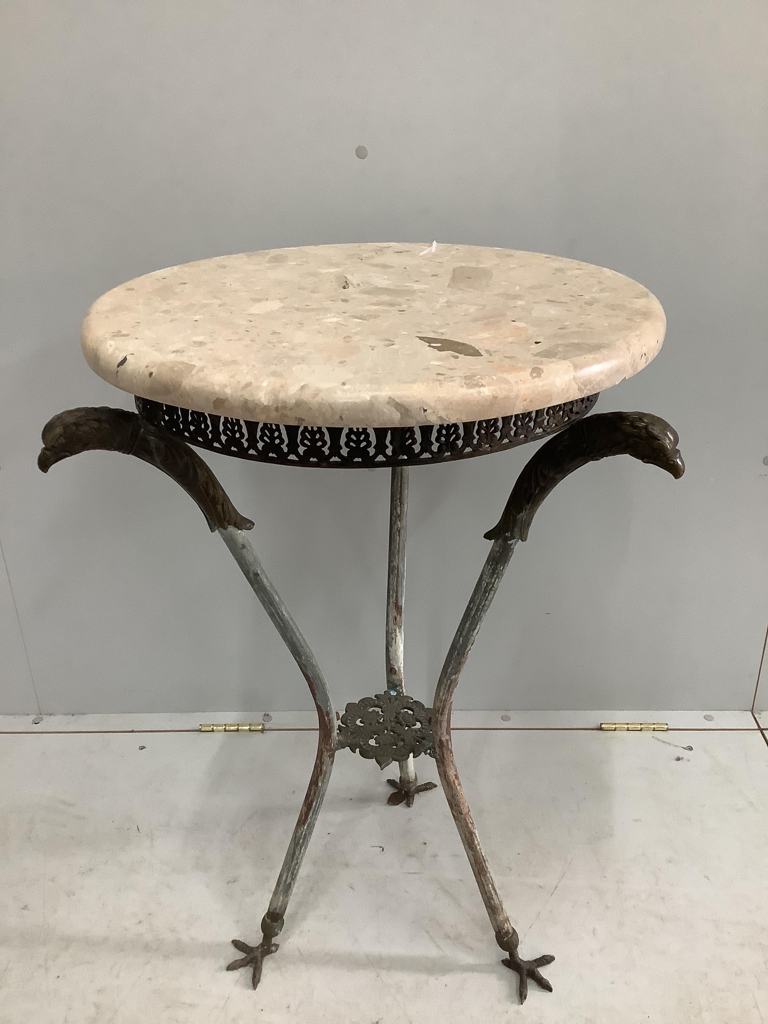 An Empire style circular cast metal, marble top occasional table with eagle head supports, diameter 53cm, height 80cm